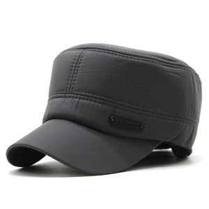 Close-up of windproof fabric and metallic logo detail on a men's winter flat top hat
