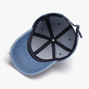 Classic washed denim baseball cap with distressed brim and cotton lining interior view