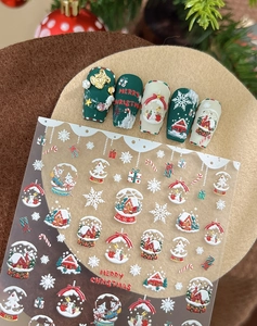Gros plan de stickers de Noël 3D en relief avec des motifs de flocons et de Père Noël