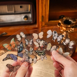 Transparent PET butterfly stickers for journaling shown in a vintage creative setting