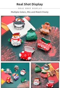 Detail view of festive acrylic Christmas hair claws featuring snowman and gingerbread man