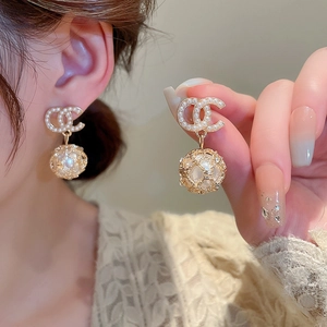 Elegant gold earrings with CC motif, faux pearls and hollow sphere detail for women