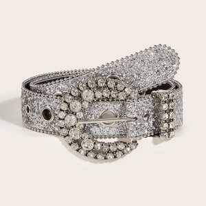 Sparkling rhinestone belt with silver sequins and decorative metal buckle on white background