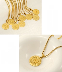 Macro shot of 18K gold plated stainless steel zodiac pendants with twisted rope chain detail