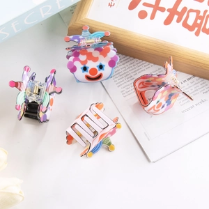 Colorful cartoon clown PVC hair claws featuring a circus theme and strong metal springs