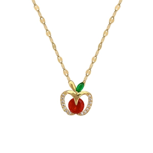 Gold hollow apple pendant necklace with red and green gemstones and white crystals