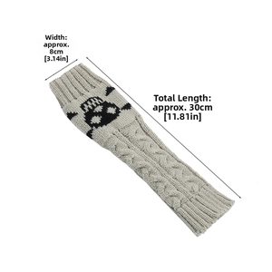 Gray knitted arm warmer with black skull pattern and size dimension marks