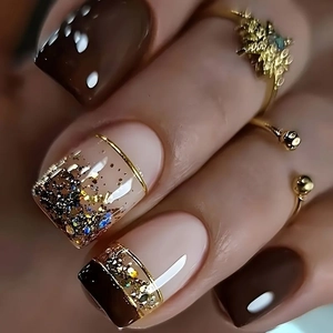 Short square press-on nails in French minimalist dark brown with gold foil flakes