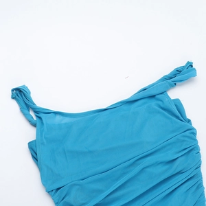 Detail of lake blue mesh fabric with elegant pleated texture and fine ruched design