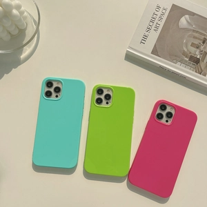 Detailed view of neon jelly silicone phone cases in blue, green, and pink for iPhone