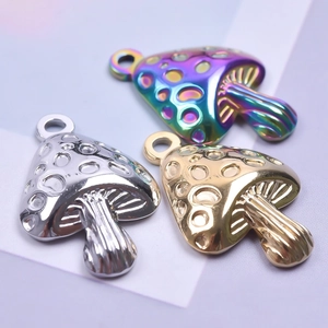 Macro detail of rainbow, silver and gold mushroom pendants on stainless steel necklaces