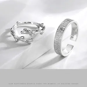Adjustable silver couple rings with tree vine texture and nature-inspired twig design