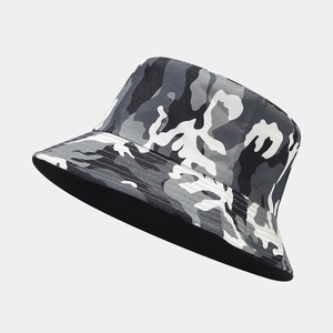 Close-up of camouflage bucket hat in grey-black patterns with durable canvas texture