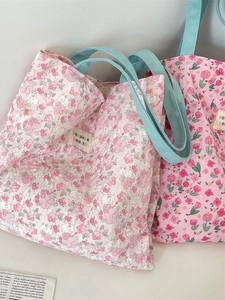 Sweet floral tote bag with pink patterns and mint green handles for casual shopping