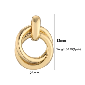 Minimalist twisted gold double loop earrings with detailed size measurements 32mm by 23mm