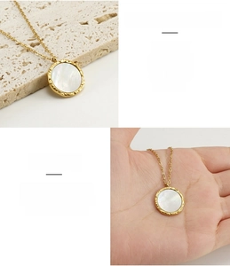 Macro view of 18K gold-plated stainless steel necklace with natural shell inlay