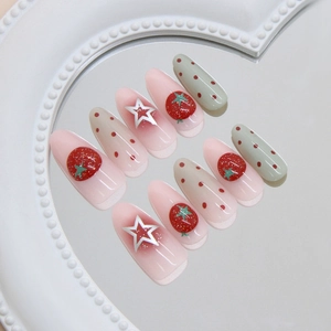 Press-on nails with 3D strawberry designs, silver stars and red polka dots gradient