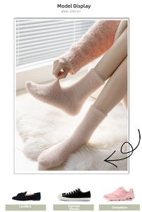 Close-up of thick coral fleece floor socks in soft pink showing plush texture and stretch
