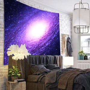Detailed shot of purple galaxy star tapestry hanging as bedroom wall decor backdrop