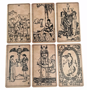 Detailed view of vintage Sea Soul Journey Oracle cards with classic black ink on brown paper