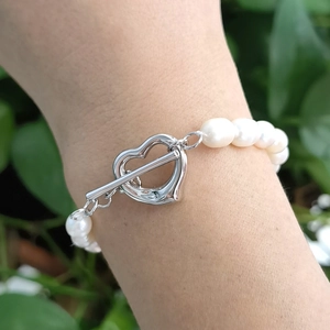 Detail of 925 silver heart toggle clasp on a natural freshwater pearl necklace