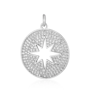 Macro shot of silver circular pendant with micro-pave crystals and cutout star pattern