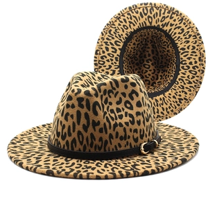 Detailed view of leopard print fedora with black leather band and gold buckle accent