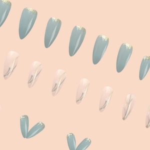Retro almond press-on nails with green glitter and white floral apricot blossoms