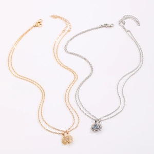 Detail of sun and moon magnetic necklaces with micro-pave crystals and center stone