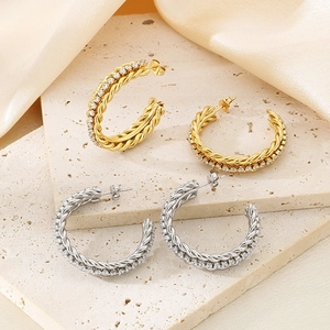 French style gold and silver C-shaped twisted earrings with zircon stones on stone
