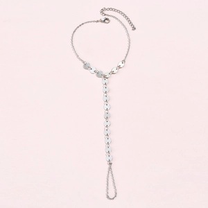 Detail of silver chain bracelet with finger ring, adjustable sequins design for women
