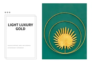Detail of luxury gold metal palm leaf wall decor with circular overlapping iron frame