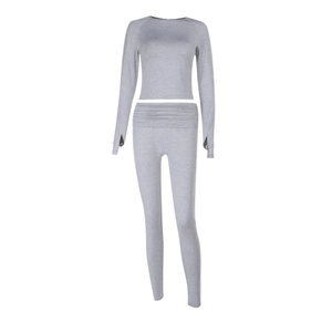 Two-piece grey marl yoga set with long sleeve crop top and high waist leggings