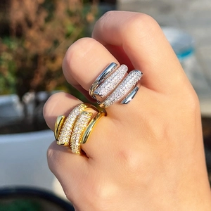 Detail showing two layered rings in gold and silver finish with sparkling micro-pave zircons