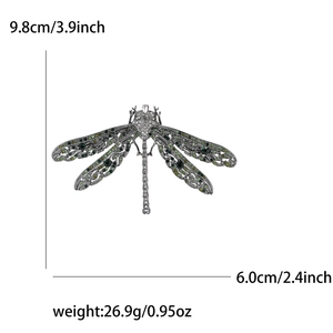 Macro detail of alloy dragonfly brooch showing green rhinestones and exact dimensions