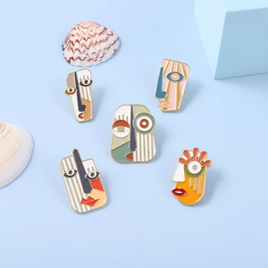 Abstract enamel face brooches in vibrant pop art colors and cubist metal design