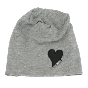 Detail of gray knitted beanie with heart leather patch and woven label texture