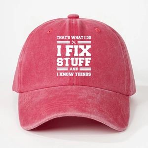 Detail of red washed cotton baseball cap with white I FIX STUFF text and tool icons