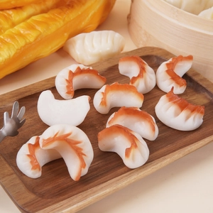 Realistic PVC fried dumpling food models displayed on a wooden tray for restaurant decor