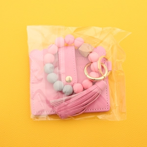 Pink silicone bead bracelet keychain with PU leather card wallet and stylish fringe tassel