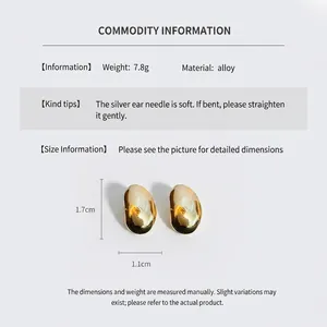 Detailed spec sheet showing 1.7cm golden bean earrings with silver pins and alloy body