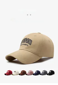 Detail view of cotton baseball cap with embroidered letters in multiple color options