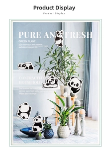 Close-up of cute cartoon panda stickers applied to home decor for DIY creative projects