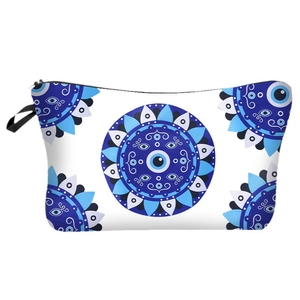 Detail of waterproof evil eye cosmetic bag showing mandala print and black zipper closure