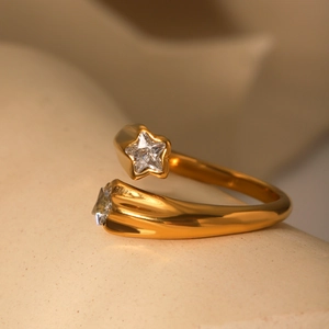 Close-up of 18K gold-plated star open ring featuring sparkling inlaid zircon crystals