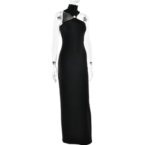 Detail of elegant halter neck maxi dress featuring a chic gold metal ring connector