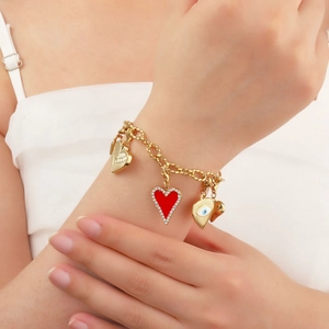 Golden titanium steel bracelet with red rhinestone heart and eye-shaped charms for women