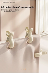 Detail van grote beige winddichte dekbedclips met zachte rubberen grepen voor stevig drogen