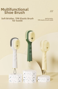 Detail of multi-functional shoe brush with soft bristles and TPR surface for suede cleaning
