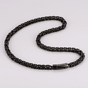 Detail of black Byzantine weave stainless steel chain necklace with cylindrical clasp